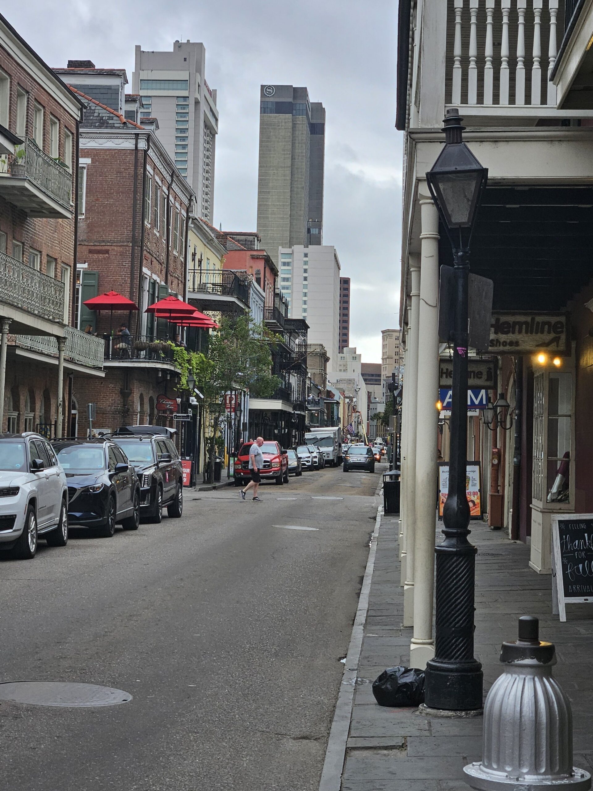 French Quarter street scene with iron balconies and gas lamps, New Orleans